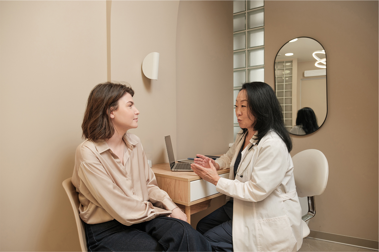 Clinician consulting with a patient in a private aesthetic clinic