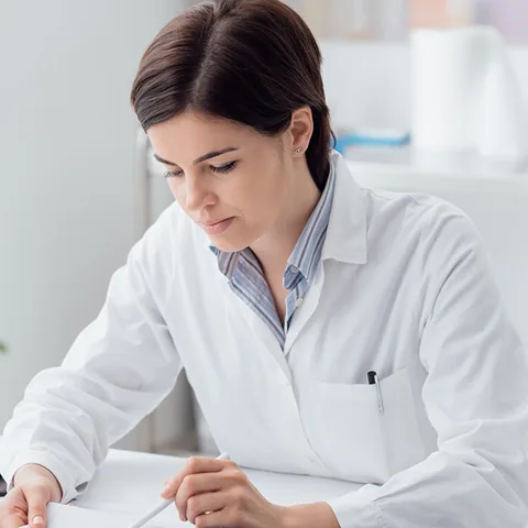 A clinician reviewing a patient's chart before the visit